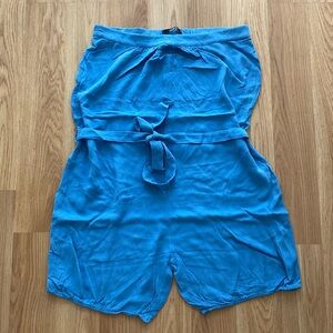 Tube style romper with belt and side pockets.